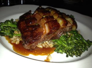 A hearty plate of duck breast with broccolini and an ancient wheat grain. Photo by Christine Willmsen