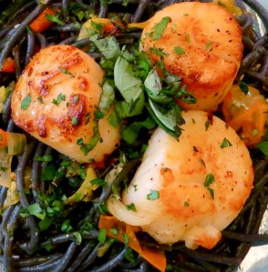 Pat dry scallops, season and sear for 2 minutes per side. Photo by Christine Willmsen