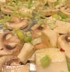 Spread parsnips, leeks and mushrooms on foil-covered baking sheet.